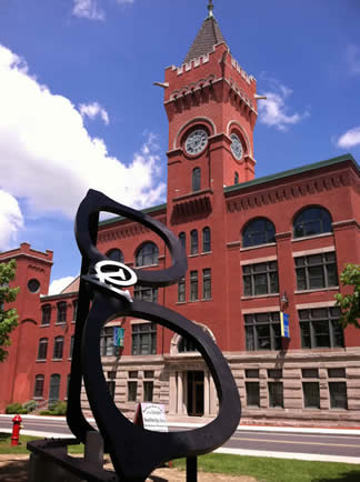 The building in the distace is American Optical where a Giant Pair of AO Eyeglasses are perched in front of the old world headquarters for eyeglasses, right in Southbridge, MA