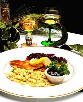 wiener schnitzel at the Vienna restaurant and Historic Inn Southbridge MA with Romer wine glasses spaetzle and red cabbage, lingonberry preserves