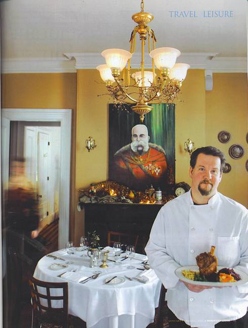 Chef, Jonathan Krach hold a Boar shank - One of Vienna Restaurants house specialty