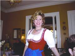 Lisa wears a dirndl & welcomes you to the Inn & Restaurant - Austrian & German Food