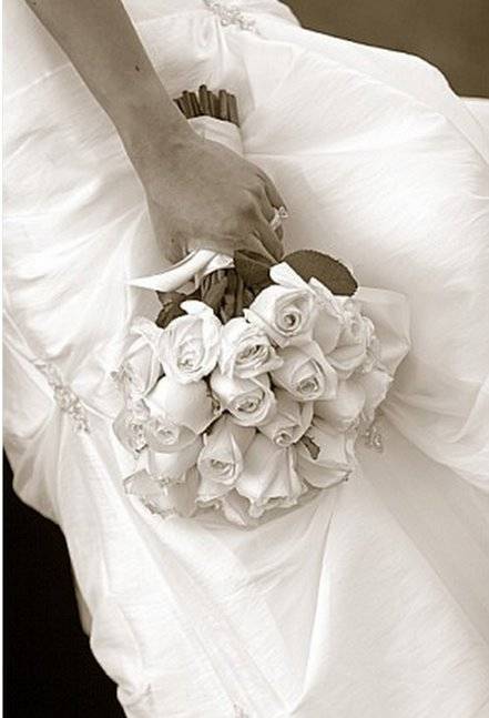 Wedding bouquet with brides hand